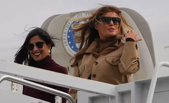 First lady Melania Trump, right, and second lady Usha Vance arrive at Arrive Albert J Ellis Airport in Richlands, N.C., en route to Camp Lejeune, Wednesday, Nov. 19, 2025. (AP Photo/Matt Rourke)