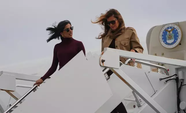 First lady Melania Trump, right, and second lady Usha Vance arrive at Arrive Albert J Ellis Airport in Richlands, N.C., en route to Camp Lejeune, Wednesday, Nov. 19, 2025. (AP Photo/Matt Rourke)