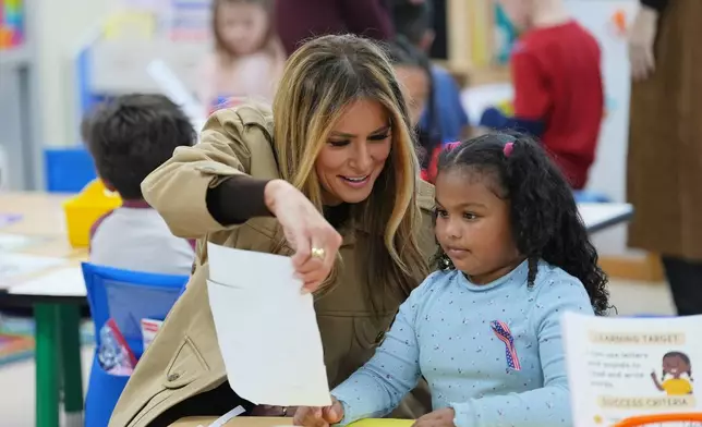 First lady Melania Trump meets with students at DeLalio Elementary School on the Marine Corps Air Station New River in Jacksonville, N.C., Wednesday, Nov. 19, 2025. (AP Photo/Matt Rourke)