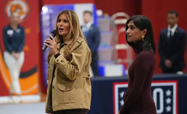 First lady Melania Trump accompanied by second lady Usha Vance speaks to students at Lejeune High School in Jacksonville, N.C., Wednesday, Nov. 19, 2025. (AP Photo/Matt Rourke)