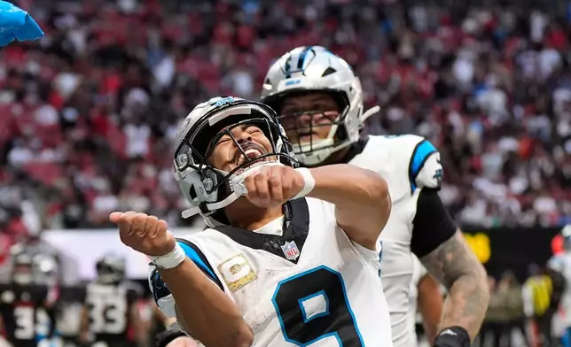 Carolina Panthers quarterback Bryce Young (9) celebrates his touchdown pass in the second half of an NFL football game against the Atlanta Falcons, Sunday, Nov. 16, 2025, in Atlanta. (AP Photo/Brynn Anderson)