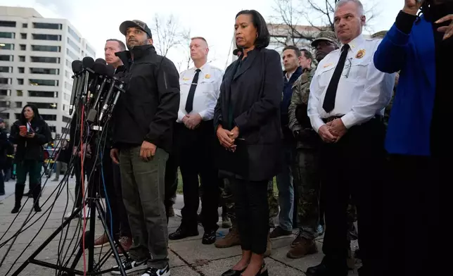 Flanked by District of Columbia Mayor Muriel Bowser, center, and Executive Assistant Chief, Metropolitan Police Department Jeffery Carroll, center left, FBI Director Kash Patel speaks during a press conference following the shooting of two National Guard soldiers near the White House Wednesday, Nov. 26, 2025, in Washington. (AP Photo/Mark Schiefelbein)