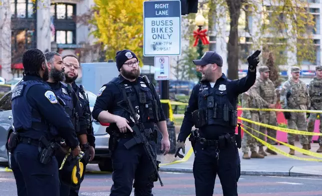 Washington Metropolitan Police are seen after reports of two National Guard soldiers shot near the White House in Washington, Wednesday, Nov. 26, 2025. (AP Photo/Evan Vucci)