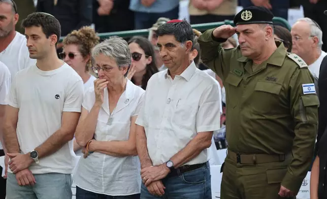 IDF chief of staff Eyal Zamir, right, with Simha Goldin and Leah Goldin, the parents and siblings of Hadar Goldin an Israeli soldier killed in Gaza in 2014 and whose body had been held there until it was released Sunday, attend his funeral in Kfar Saba, Israel, Tuesday, Nov. 11, 2025. (Abir Sultan/Pool via AP)