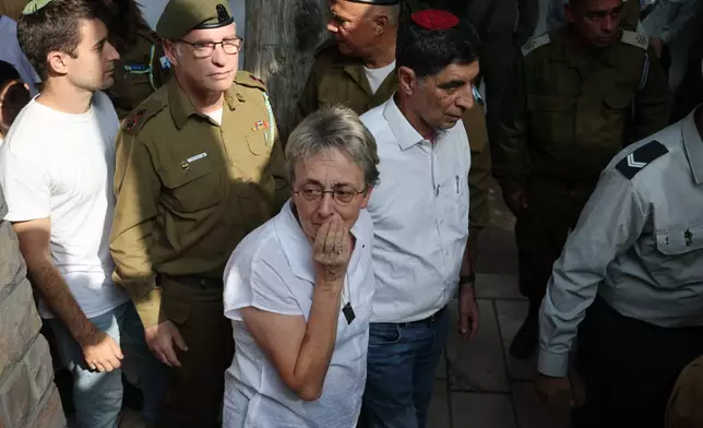 Leah and Simcha Goldin, the parents of late Israeli hostage soldier Hadar Goldin, attend his funeral, in Kfar Saba, Israel, Tuesday, Nov. 11, 2025. Goldin was killed in 2014 and his body was returned as part of the current ceasefire deal between Israel and Hamas. (Abir Sultan/Pool Photo via AP)