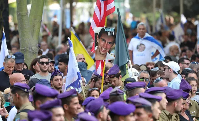 Israeli soldiers attend the funeral of Hadar Goldin, an Israeli soldier killed in Gaza in 2014 and whose body had been held there until it was released Sunday, in Kfar Saba, Israel, Tuesday, Nov. 11, 2025. (Abir Sultan/Pool via AP)
