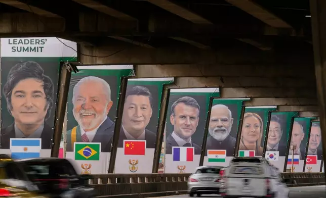 Banners of various G20 leaders are displayed along a Johannesburg freeway, in Johannesburg, South Africa, Thursday, Nov. 20, 2025. (AP Photo/Themba Hadebe)