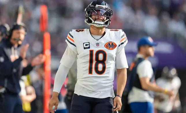 Chicago Bears quarterback Caleb Williams (18) reacts after throwing an incomplete pass during the first half of an NFL football game against the Minnesota Vikings, Sunday, Nov. 16, 2025, in Minneapolis. (AP Photo/Abbie Parr)