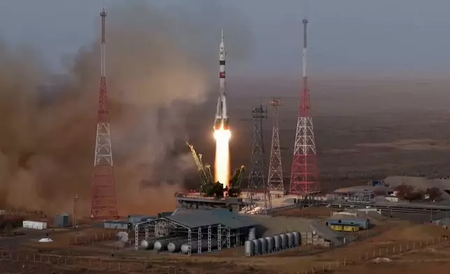In this photo taken from video released by Roscosmos space corporation, the Soyuz-2.1 rocket booster with Soyuz MS-28 space ship carrying NASA astronaut Chris Williams and Roscosmos cosmonauts Sergey Kud-Sverchkov and Sergey Mikaev, a new crew to the International Space Station, ISS, blasts off in Russian leased Baikonur cosmodrome, Kazakhstan, Thursday, Nov. 27, 2025. (Roscosmos space corporation, via AP)