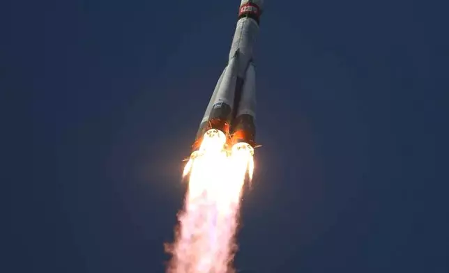 In this image released by Roscosmos space corporation, the Soyuz-2.1 rocket booster with Soyuz MS-28 space ship carrying NASA astronaut Chris Williams and Roscosmos cosmonauts Sergey Kud-Sverchkov and Sergey Mikaev, a new crew to the International Space Station, ISS, blasts off in Russian leased Baikonur cosmodrome, Kazakhstan, Thursday, Nov. 27, 2025. (Roscosmos space corporation, via AP)