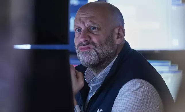 Specialist Meric Greenbaum works on the floor of the New York Stock Exchange, Thursday, Nov. 6, 2025. (AP Photo/Richard Drew)