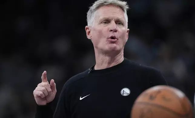 Golden State Warriors head coach Steve Kerr talks to his players during the second half of an NBA Cup basketball game against the San Antonio Spurs in San Antonio, Friday, Nov. 14, 2025. (AP Photo/Eric Gay)