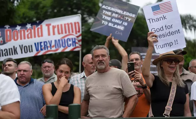 FILE - White South Africans demonstrate in support of U.S. President Donald Trump in front of the U.S. embassy in Pretoria, South Africa, Feb. 15, 2025. (AP Photo/Jerome Delay, File)