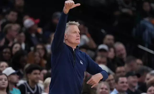 Golden State Warriors head coach Steve Kerr signals to his players during the second half of an NBA basketball game against the San Antonio Spurs in San Antonio, Wednesday, Nov. 12, 2025. (AP Photo/Eric Gay)