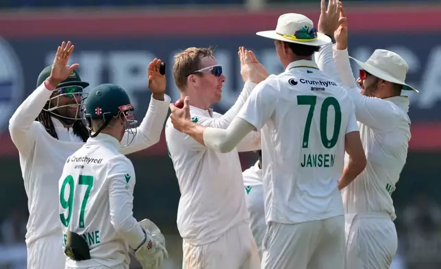 South Africa's players celebrate the dismissal of India's Yashasvi Jaiswal on the third day of the second cricket test match between India and South Africa in Guwahati, India, Saturday, Nov. 22, 2025. (AP Photo/Anupam Nath)