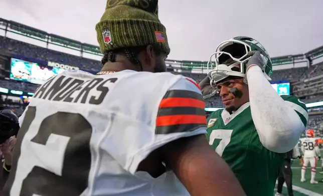 Cleveland Browns quarterback Shedeur Sanders (12) and New York Jets quarterback Justin Fields (7) greet each other after their NFL football game, Sunday, Nov. 9, 2025, in East Rutherford, N.J. (AP Photo/Yuki Iwamura)