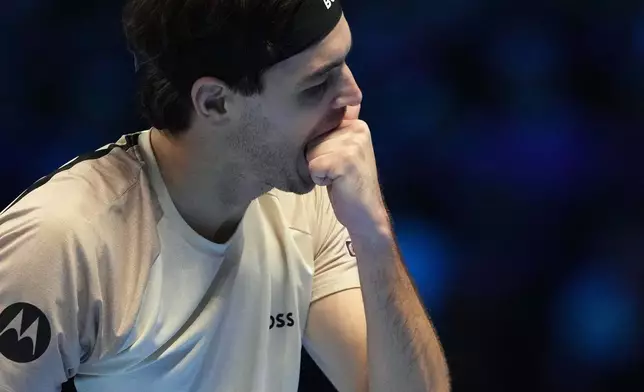United States' Taylor Fritz reacts tduring a match against Italy's Lorenzo Musetti during their singles tennis match of the ATP World Tour Finals, in Turin, Italy, Monday, Nov. 10, 2025. (AP Photo/Antonio Calanni)