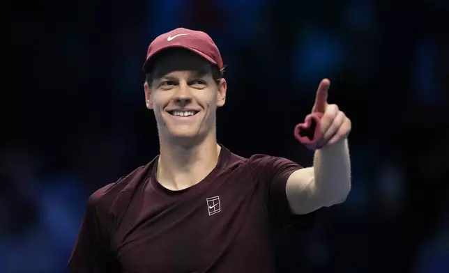 Italy's Jannik Sinner celebrates after winning against Canada's Felix Auger-Aliassime during their tennis match of the ATP World Tour Finals, in Turin, Italy, Monday, Nov. 10, 2025. (AP Photo/Antonio Calanni)