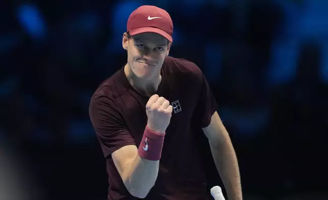 Italy's Jannik Sinner celebrates after winning a point to Canada's Felix Auger-Aliassime during their tennis match of the ATP World Tour Finals, in Turin, Italy, Monday, Nov. 10, 2025. (AP Photo/Antonio Calanni)