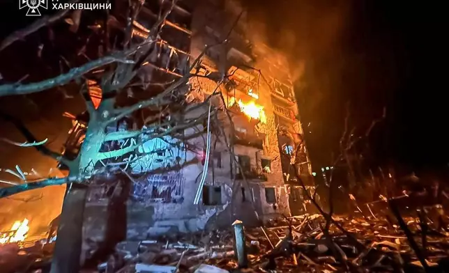 In this photo provided by the Ukrainian Emergency Service, emergency services personnel work to extinguish a fire following a Russian attack in Balakliya, Kharkiv region, Ukraine, Monday, Nov. 17, 2025. (Ukrainian Emergency Service via AP)