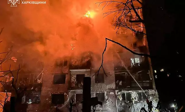 In this photo provided by the Ukrainian Emergency Service, emergency services personnel work to extinguish a fire following a Russian attack in Balakliya, Kharkiv region, Ukraine, Monday, Nov. 17, 2025. (Ukrainian Emergency Service via AP)