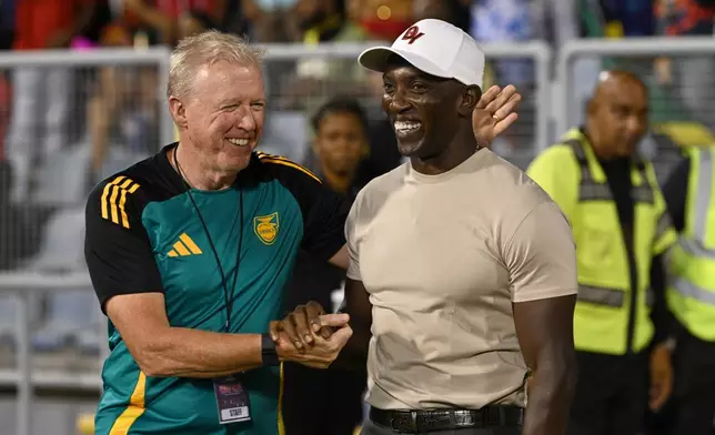 Jamaica's coach Steve McClaren, left, greets Trinidad and Tobago's coach Dwight Yorke during a World Cup 2026 qualifying soccer match in Port of Spain, Trinidad and Tobago, Thursday, Nov. 13, 2025. (AP Photo/Robert Taylor)