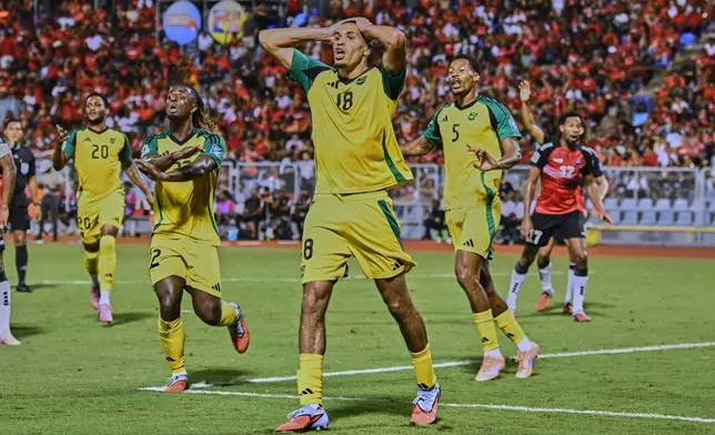 Jamaica's Jonathan Russell, center, appeals after his goal against Trinidad and Tobago was disallowed during a World Cup 2026 qualifying soccer match in Port of Spain, Trinidad and Tobago, Thursday, Nov. 13, 2025. (AP Photo/Robert Taylor)