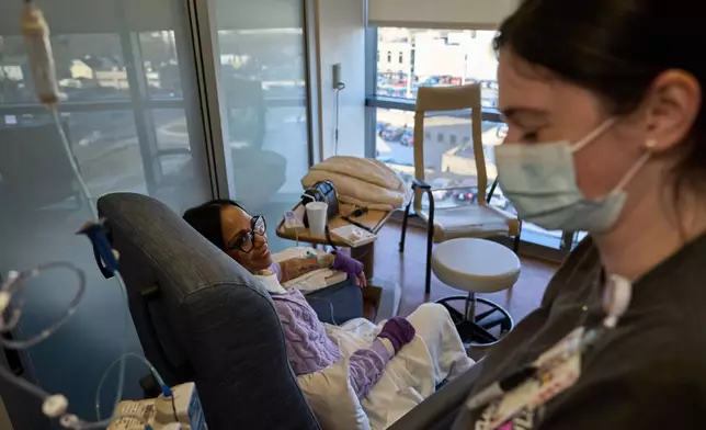 Ruth Wilson, left, whose lupus took six years to diagnose, receives her monthly lupus-focused IV treatment at UMass Memorial Medical Center, Jan. 14, 2025, in Worcester, Mass. (AP Photo/David Goldman)
