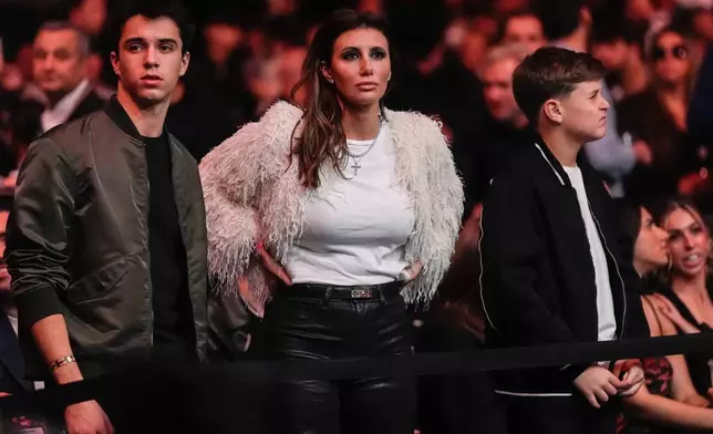 Alina Habba, center, watches the UFC 322 mixed martial arts event, Saturday, Nov. 15, 2025, in New York. (AP Photo/Yuki Iwamura)