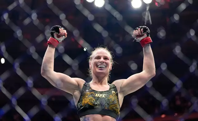 Kyrgyzstan's Valentina Shevchenko celebrates after defeating China's Zhang Weili during a women's flyweight title bout at a UFC 322 mixed martial arts event, Saturday, Nov. 15, 2025, in New York. (AP Photo/Yuki Iwamura)