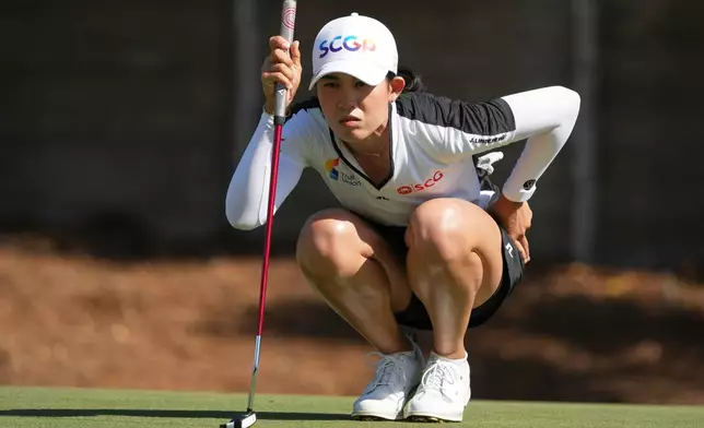 CORRECTS FIRST NAME - Pajaree Anannarukarn of Thailand looks at her shot on the second green during the third round of the LPGA Tour Championship golf tournament, Saturday, Nov. 22, 2025, in Naples, Fla. (AP Photo/Marta Lavandier)