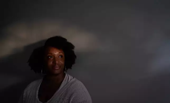 Kiara Alexander, who was hospitalized with autoimmune encephalitis, poses for a photo at her home, Friday, Oct. 10, 2025, in Charlotte, N.C. (AP Photo/David Goldman)
