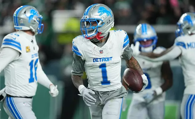 Detroit Lions wide receiver Jameson Williams (1) reacts after scoring a touchdown during the first half of an NFL football game against the Philadelphia Eagles on Sunday, Nov. 16, 2025, in Philadelphia. (AP Photo/Matt Rourke)