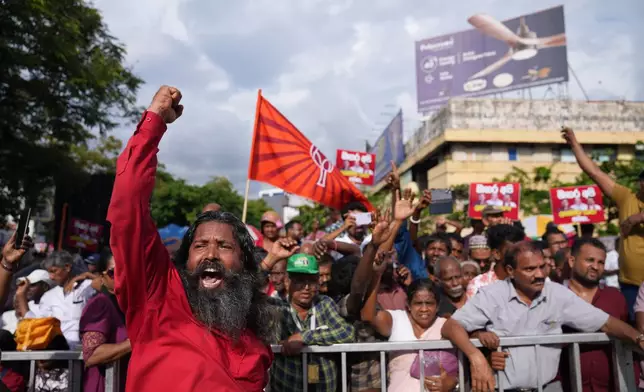 A man shout anti government slogans supporting Sri Lankan lawmaker Namal Rajapaksa, heir to the once-powerful Rajapaksa dynasty, during a public rally in Colombo, Sri Lanka, Friday, Nov. 21, 2025. (AP Photo/Eranga Jayawardena)