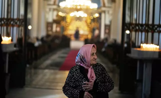 Armenian worshippers pray during Sunday Mass at the Surp Asdvadzadzin Patriarchal Church in Istanbul, Turkey, Sunday, Nov. 23, 2025, ahead of the visit of Pope Leo XIV to Turkey. (AP Photo/Khalil Hamra)