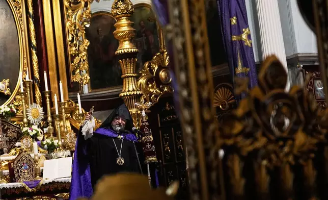Archbishop Sahak II Mashalian, Armenian Patriarch of Constantinople, leads Sunday Mass at the Surp Asdvadzadzin Patriarchal Church in Istanbul, Turkey, Sunday, Nov. 23, 2025, ahead of the visit of Pope Leo XIV to Turkey. (AP Photo/Khalil Hamra)