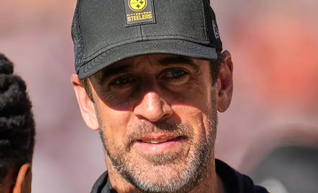 Pittsburgh Steelers quarterback Aaron Rodgers stands on the sidelines during the first half of an NFL football game against the Chicago Bears, Sunday, Nov. 23, 2025, in Chicago. (AP Photo/Erin Hooley)