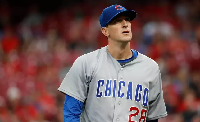 FILE - Chicago Cubs starting pitcher Kyle Hendricks walks back to the dugout in the third inning of a baseball game against the Cincinnati Reds, June 21, 2018, in Cincinnati. (AP Photo/John Minchillo, File)