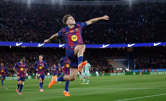 Barcelona's Fermin Lopez celebrates after scoring during a La Liga soccer match between Barcelona and Athletic in Barcelona, Spain, Saturday, Nov. 22, 2025. AP Photo/Joan Monfort)