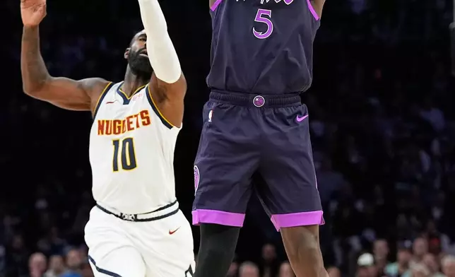 Minnesota Timberwolves guard Anthony Edwards (5) shoots as Denver Nuggets guard Tim Hardaway Jr. (10) defends during the first half of an NBA basketball game, Saturday, Nov. 15, 2025, in Minneapolis. (AP Photo/Abbie Parr)