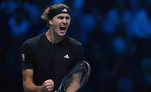 Germany's Alexander Zverev reacts after winning a point against United States' Ben Shelton during their singles tennis match of the ATP World Tour Finals, in Turin, Italy, Sunday, Nov. 9, 2025. (AP Photo/Antonio Calanni)