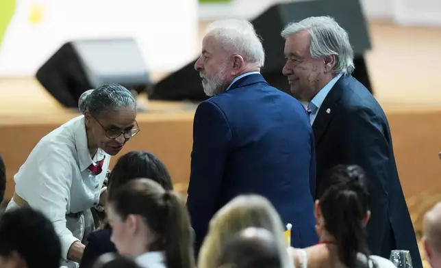 Brazil President Luiz Inacio Lula da Silva, center, U.N. Secretary-General Antonio Guterres, right, and Brazil Environment Minister Marina Silva attend a plenary session at the COP30 U.N. Climate Summit in Belem, Brazil, Thursday, Nov. 6, 2025. (AP Photo/Fernando Llano)