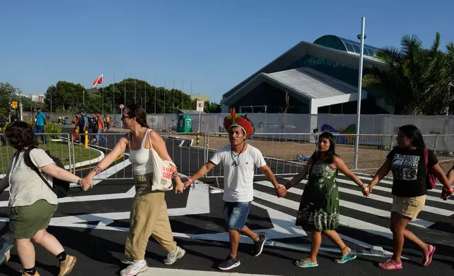 Indigenous people and activists take part in a demonstration in defense of the Amazon during the COP30 U.N. Climate Summit, in Belem, Para state, Brazil, Thursday, Nov. 6, 2025. (AP Photo/Eraldo Peres)