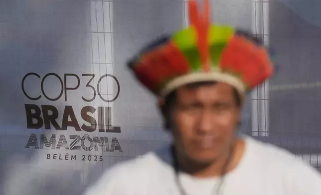 An indigenous man takes part in a demonstration in defense of the Amazon during the COP30 U.N. Climate Summit, in Belem, Para state, Brazil, Thursday, Nov. 6, 2025. (AP Photo/Eraldo Peres)