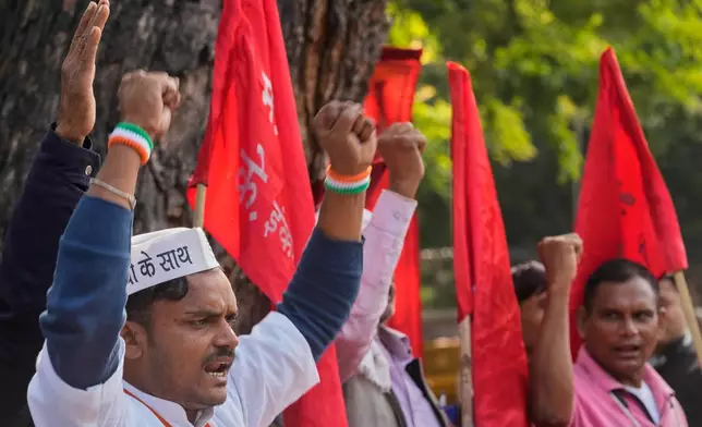 Members of various Indian trade unions shout slogans during a protest against the government's rollout of new labor codes in New Delhi, India, Wednesday, Nov. 26, 2025. (AP Photo/Manish Swarup)