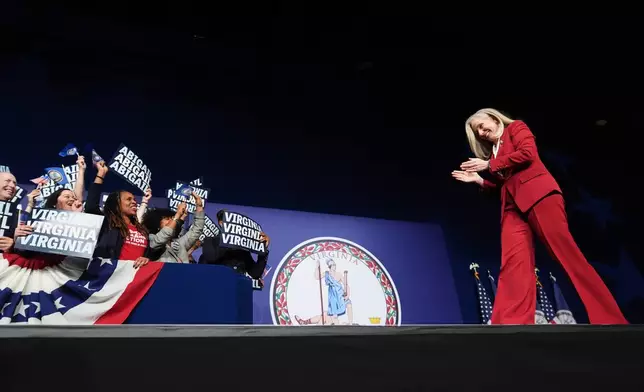 Democrat Abigail Spanberger walks out on stage after she was declared the winner of the Virginia governor's race during an election night watch party Tuesday, Nov. 4, 2025, in Richmond, Va. (AP Photo/Stephanie Scarbrough)