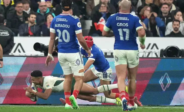 South Africa's Sacha Feinberg-Mngomezulu scores a try during the rugby union Nations Series match between France and South Africa in Saint-Denis, outside Paris, Saturday, Nov. 8, 2025 . (AP Photo/Michel Euler)