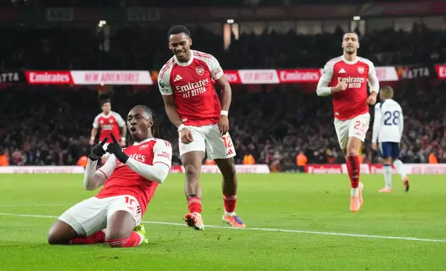 Arsenal's Eberechi Eze celebrates after scoring during a Premier League soccer match between Arsenal and Tottenham in London, Sunday, Nov. 23, 2025. (AP Photo/Frank Augstein)