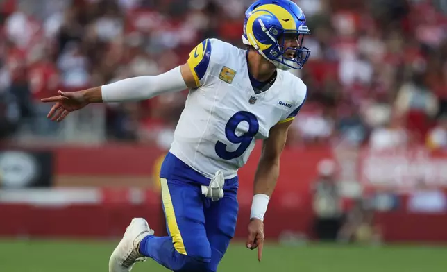 Los Angeles Rams quarterback Matthew Stafford (9) celebrates after throwing a touchdown pass to tight end Colby Parkinson during the second half of an NFL football game against the San Francisco 49ers in Santa Clara, Calif., Sunday, Nov. 9, 2025. (AP Photo/Jed Jacobsohn)