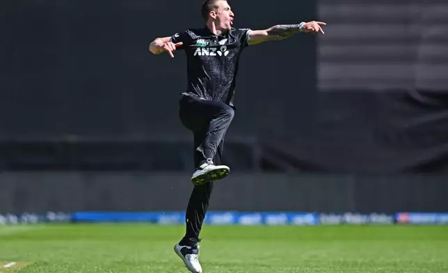 Blair Tickner of New Zealand reacts after he dismissed Sam Curran of England during the One Day International cricket match between New Zealand and England in Wellington, New Zealand, Saturday, Nov. 1, 2025. (Kerry Marshall/Photosport via AP)